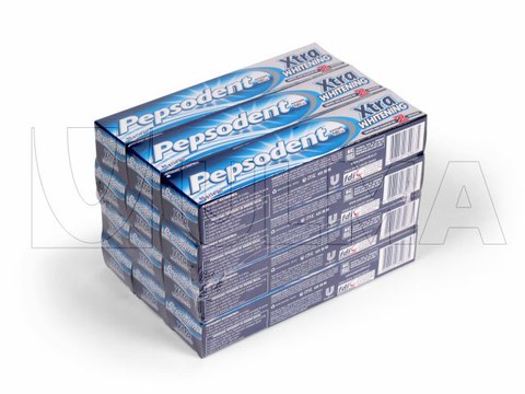 Packaging and shrinking of toothpaste box packs in polyolephyne film.