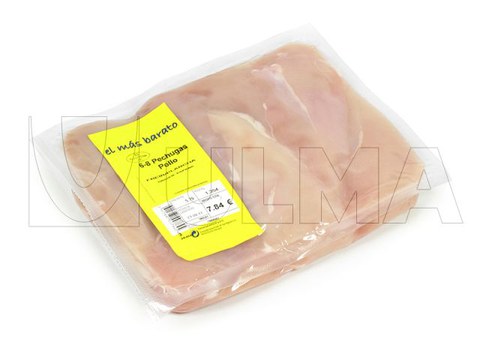Chicken breasts vacuum packaging in thermoforming