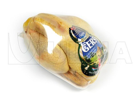 Envasado de pollo entero en flow Pack con film retráctil barrera (BDF)